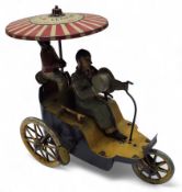 A Lehman Clockwork Tinplate New Century Cycle No.345, with blue and yellow tricycle, yellow spoked