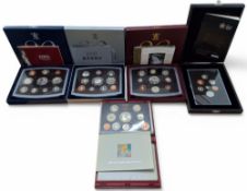 A Royal Mint 1998 United Kingdom Deluxe Proof Set; Royal Mint 2000, 2001 and 2002 United Kingdom