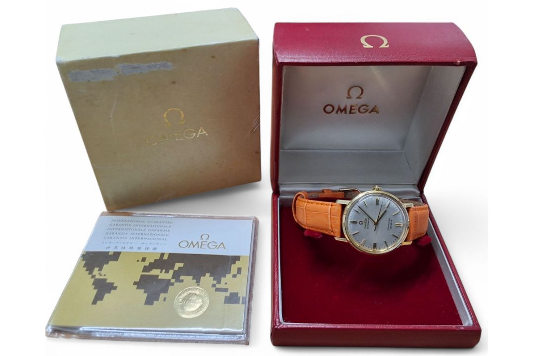 An 18ct gold Omega Automatic Seamaster DeVille, silver coloured dial, gold baton markers, date