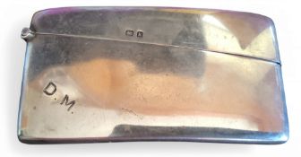 A silver bowed rectangular card case, 4.5cm high, 8.5cm wide, Jones & Crompton, Birmingham 1909,