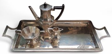 An Edwardian bachelors three piece octagonal coffee set and tray comprising coffee pot, Bakelite