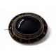 A Victorian gilt metal mourning brooch, oval banded onyx cabochon, banded black enamel border, - Image 1 of 2