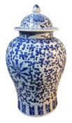 A 19th century Chinese inverted baluster vase and cover, painted stylised flowerhead and scrolling