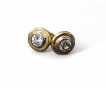 A pair of 18ct gold and diamond stud earrings, each earring set with a round brilliant cut
