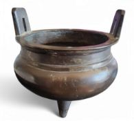 A Chinese bronze tripod ding censer, angular lug handles, 12.5cm diam, six character mark