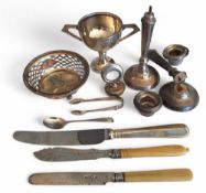 A silver circular bon bon dish, open work sides, vacant cartouche, three ball feet, Gorham