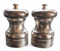 A pair of silver salt and pepper grinders with contents,10cms high, A J Poole, Birmingham, 2014,