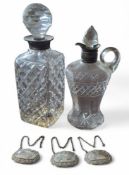 A silver collared cut glass whisky decanter, Garrard & Co Ltd, Birmingham, 1959; an Edwardian silver