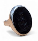 A Slavery Abolition silver seal ring, the black glass moulded in relief of a man in chains under the