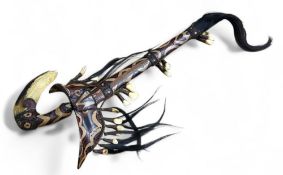 A Ceremonial Dayak Mandau or Parang Ihlang sword from Borneo, highly decorated, animal hair