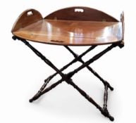 A 19th century mahogany butler’s tray, on stand, the tray top with drop leaves to sides,