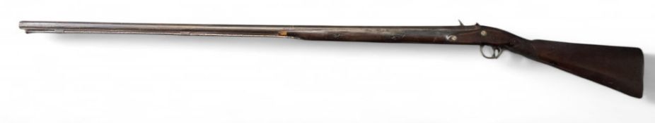 An 18th century flintlock fowling gun, 124cm barrel tapering from octagonal to round, 0.68 bore,