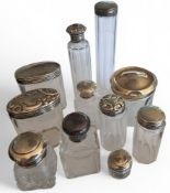 Victorian and later silver and glass vanity jars, the tallest 17.5cms, all hallmarked (11)