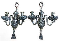 A pair of Sheffield plated two branch two light wall lights, campana shaped sconces, bold acanthus