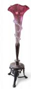 A Victorian cranberry glass and plated epergne, with flared trumpet with spiralled printee frill,