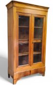 A 19th century French chestnut housekeeper's cupboard, ogee cornice above two glazed crossbanded