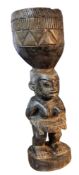 Tribal Art - a Pende/Yaka people of the Democratic Republic of Congo hardwood figural mortar, 60cm