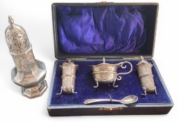 A cased silver three piece cruet set, central girdle, wavy rims, shell and pad feet, Charles