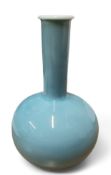 A Chinese Jingdezhen porcelain celadon glazed stem vase, six character marks and inscription to