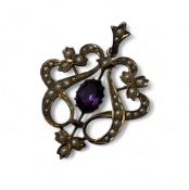 An Edwardian 9ct gold, amethyst and seed pearl drop pendant, the openwork mount set with seed pearls