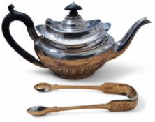 An Edwardian silver quarter fluted teapot, hinged cover, ebony finial, scroll capped ebony handle