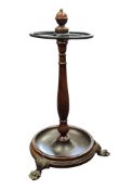 A 19th century design mahogany and brass-mounted stick stand, turned baluster and finial, circular