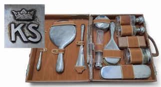 A German silver-mounted travelling dressing table set, each silver piece with applied initials KS