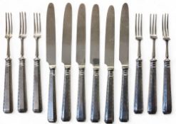 A set of six silver hafted fruit knives and forks, the hafts with bead and dot borders, Thomas