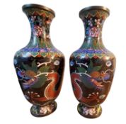 A pair of Chinese cloisonne enamel ovoid vases, decorated in the famille noir palette with dragons