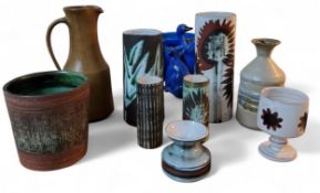 A Briglin Art Pottery cylindrical vase, decorated with stylised flowers, on a white ground, 23.5cm