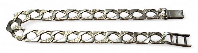 A 9ct gold flat curb link bracelet, textured links, hallmarked, 10.6g