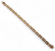 A 9ct gold fancy link bracelet, stamped 9ct, 14g