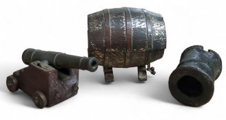 A patinated metal desk cannon, probably late 19th/early 20th century, with a turned barrel, on a
