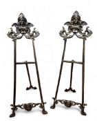 A pair of Rococo brass picture easels, 58cm high, 22.5cm wide