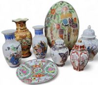 Decorative ceramics - a large Satsuma style ceramic egg, decorated with flowers and a fanciful bird,