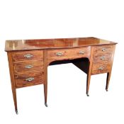 An Edwardian mahogany bow front sideboard, barberpole stringing, with central drawer, three