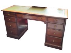 A 19th century mahogany kneehole desk, tooled green leather writing surface, fitted with one long