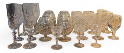 A set of six cut glass brandy glasses;   others;  champagne flutes;   sherry glasses;  etc