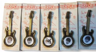 A set of five contemporary 'The Fabulous' Beatles jewellery brooches, four featuring a portrait of
