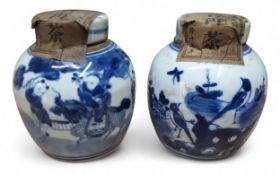 A pair of Chinese blue & white ginger jars and covers, painted in underglazed blue with oriental