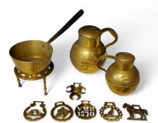 Metal Ware - a brass open saucepan, steel handle, 17cm diam;   a trivet;  two graduated Jersey jugs;