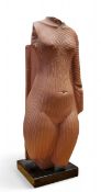 A Louvre Museum plaster cast of Torso of Queen Nefertiti, wearing a pleated garment, black plinth,