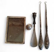 A silver rectangular photograph frame, quite plain, Birmingham 1920; a silver hafted button hook,