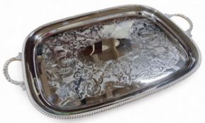 An Elkington plate rounded rectangular two handled gallery tray, the field die stamped with