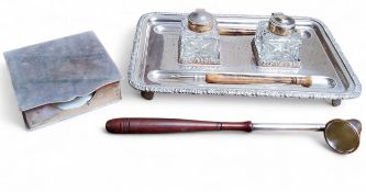 A rounded rectangular standish, two square cut glass wells, silver collars and hinged covers,
