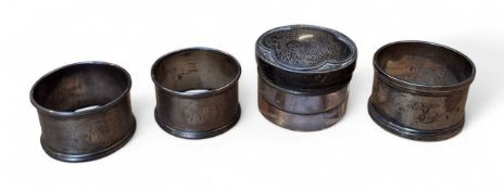 A pair of Edwardian silver circular napkin rings, engine turned in bands, Cornelius Desormeaux