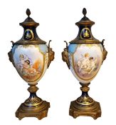 A pair of 19th century ormolu mounted 'Sevres' style pedestal ovoid vases and covers, decorated with