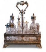 A Victorian Elkington and Co electroplated rectangular seven-bottle cruet stand, central loop