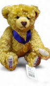 A Steiff Golden  Jubilee bright gold mohair teddy bear, made exclusively for Danbury Mint,  purple