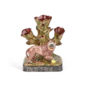 A STAFFORDSHIRE POTTERY 'LION' SPILL VASE CIRCA 1830